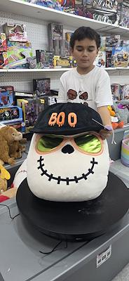 Halloween skeleton plush with BOO hat and green sunglasses